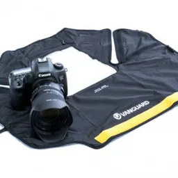 Rain Cover Vanguard ALTA RCL Large Camera Rain Cover. The ALTA RCL Rain Cape (Large) is an ingenious shooting in the rain solution designed to protect a DSLR with 400mm or Ultra-Telephoto lens attached. This multi-use cover folds into a compact pouch and easily fits in any bag so that you are never caught out in a downpour without adequate protection. Always protected – comprehensive rain protection Quick-action – no fumbling simple 3-second set-up Clear view – transparent TPU window for easy use of screen, controls, and viewfinder No fumbling – fits all sized hands also with gloves on Supported – use with Tripod or Monopod Ease of transport – folds up into a compact pouch Style  Camera Rain Cover Size  Large Suitable For  Example  Canon 1Ds Mark III/ Nikon D4 with 400mm f/2.8, 200-400mm f/4 lens attached Transparent Window To See Camera Screen  Yes Weight  120g Dimensions (laid flat)  860%3F950mm Colour  Black Series  Alta Accessories Other  Includes carry pouch